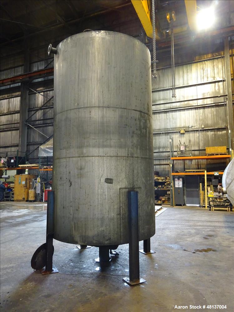 Used Tank, 4,000 Gallon, 304 Stainless steel, Vertical. Approximate 89" diameter x 155" straight side, flat top, cone bottom. Top openings: 3", (2) 4". Side openings: 18" man way with cover, 4", 8" c...