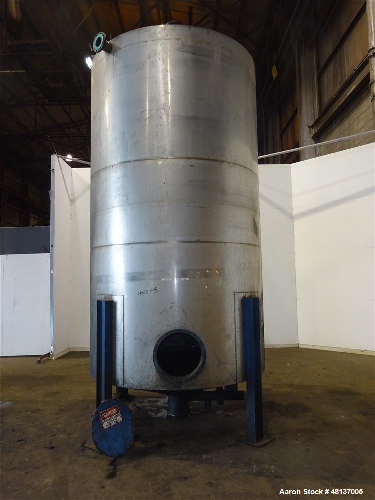 Used Tank, 4,000 Gallon, 304 Stainless steel, Vertical. Approximate 88" diameter x 155" straight side, flat top, cone bottom. Top openings: 3", (2) 4. Side openings: 18" man way with cover, 4", 8" ce...