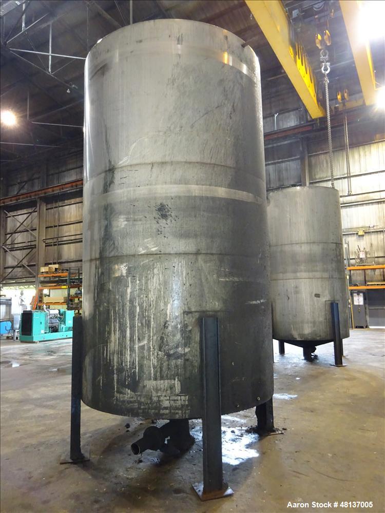 Used Tank, 4,000 Gallon, 304 Stainless steel, Vertical. Approximate 88" diameter x 155" straight side, flat top, cone bottom. Top openings: 3", (2) 4. Side openings: 18" man way with cover, 4", 8" ce...