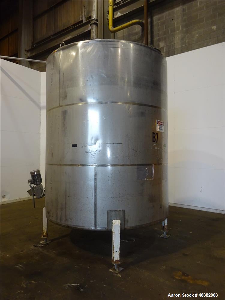 Used Tank, 3,000 Gallons, 304 Stainless Steel, Vertical. Approximate 92" diameter x 108" straight side, flat top, cone bottom. Side entering 4-blade agitator driven by a 5hp, 3/60/230/460 volt, 1725 ...