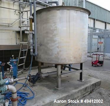 Used Tank, Approximately 1,000 Gallon, Stainless steel.  Used as a Chilled water tank, 6' dia, 5' high, with connectingpumps