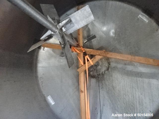 Used Tank, 2400 Gallon, Stainless Steel, Vertical. Approximate 94" diameter x 88" straight side. Flat top with (2) 1/3 hinged covers, dished bottom. Top entering Pfaudler mode FDWU agitator, driven b...