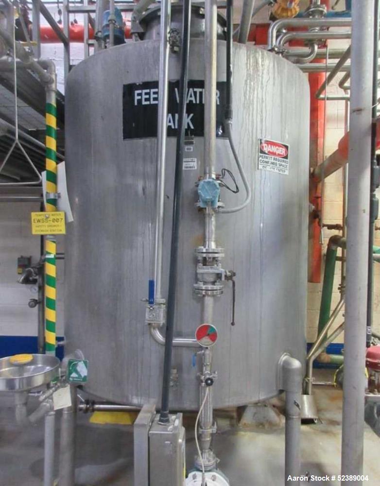 Used 1200 Gallon Stainless Steel Tank, Vertical. Approximate 66" diameter x 80" deep. Dished top & bottom heads. Openings top: 20" diameter manway with cover, (1) 4" tri-clamp reduced to 2", (1) 3" d...