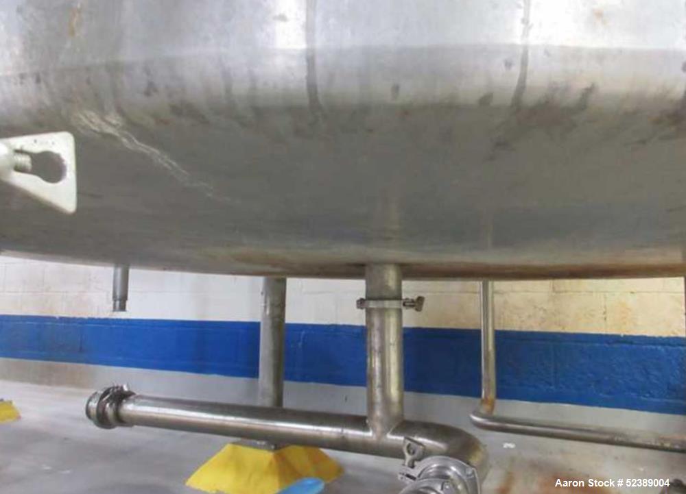 Used 1200 Gallon Stainless Steel Tank, Vertical. Approximate 66" diameter x 80" deep. Dished top & bottom heads. Openings top: 20" diameter manway with cover, (1) 4" tri-clamp reduced to 2", (1) 3" d...