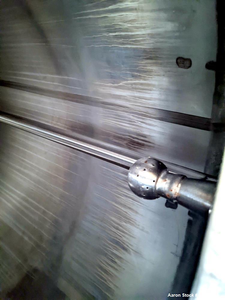 Used 1200 Gallon Stainless Steel Tank, Vertical. Approximate 66" diameter x 80" deep. Dished top & bottom heads. Openings top: 20" diameter manway with cover, (1) 4" tri-clamp reduced to 2", (1) 3" d...