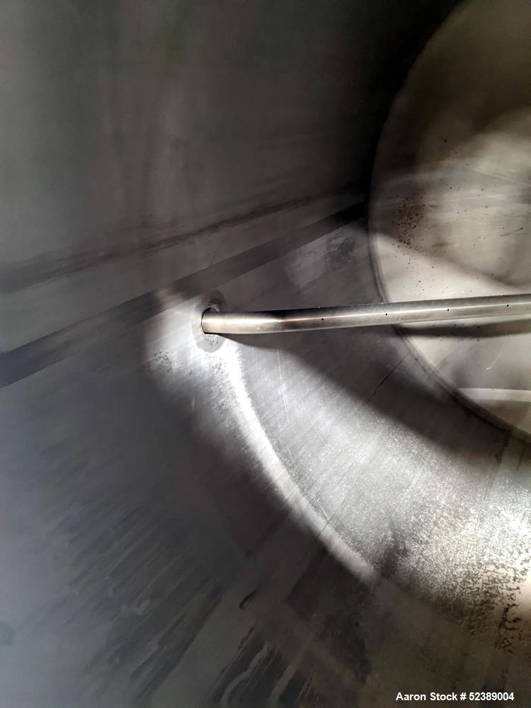 Used 1200 Gallon Stainless Steel Tank, Vertical. Approximate 66" diameter x 80" deep. Dished top & bottom heads. Openings top: 20" diameter manway with cover, (1) 4" tri-clamp reduced to 2", (1) 3" d...