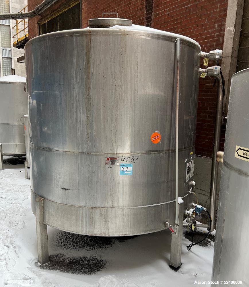 Used Falco Tank, Approximate 2500 Gallon, 304 Stainless Steel, Vertical. Approximate 96" diameter x 84" straight side, coned top & bottom. Mounted on 4 stainless legs. Serial# 2912,