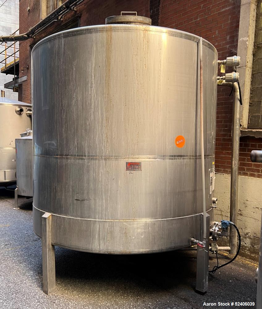 Used Falco Tank, Approximate 2500 Gallon, 304 Stainless Steel, Vertical. Approximate 96" diameter x 84" straight side, coned top & bottom. Mounted on 4 stainless legs. Serial# 2912,