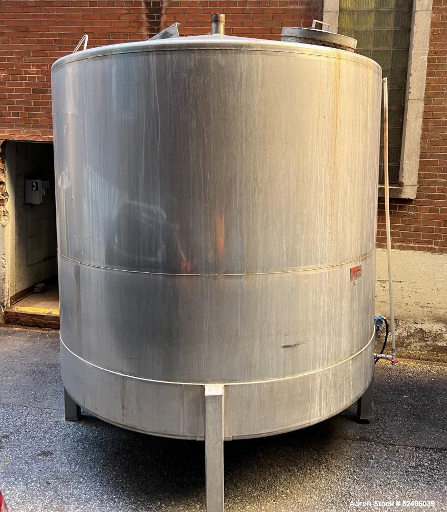 Used Falco Tank, Approximate 2500 Gallon, 304 Stainless Steel, Vertical. Approximate 96" diameter x 84" straight side, coned top & bottom. Mounted on 4 stainless legs. Serial# 2912,