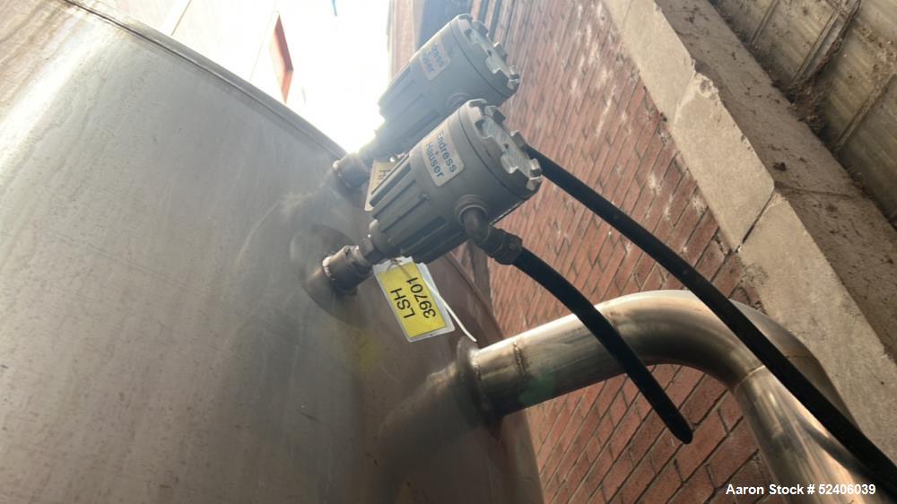 Used Falco Tank, Approximate 2500 Gallon, 304 Stainless Steel, Vertical. Approximate 96" diameter x 84" straight side, coned top & bottom. Mounted on 4 stainless legs. Serial# 2912,