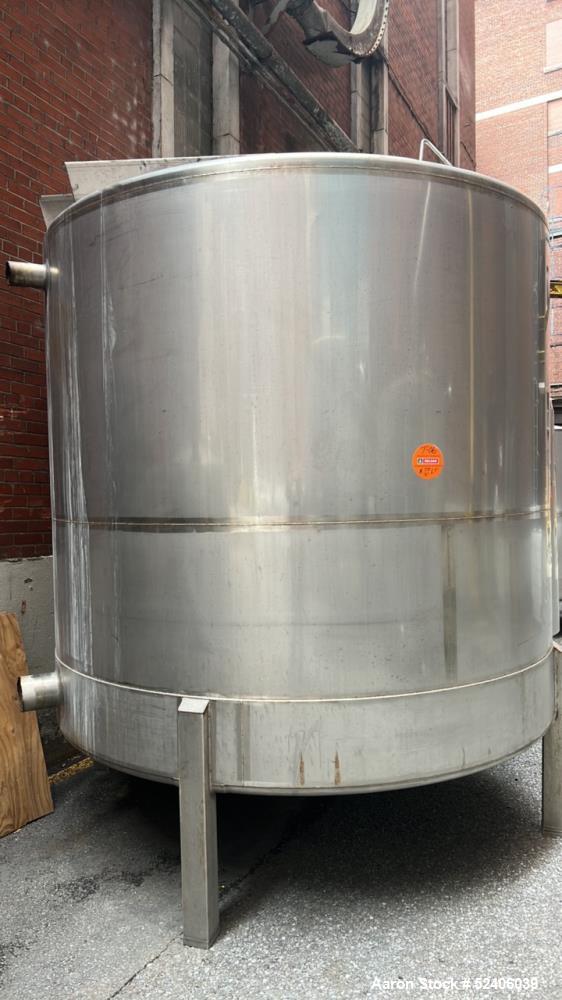 Used Falco Tank, Approximate 2500 Gallon, 304 Stainless Steel, Vertical. Approximate 96" diameter x 84" straight side, coned top & bottom. Mounted on 4 stainless legs. Serial# 2912,