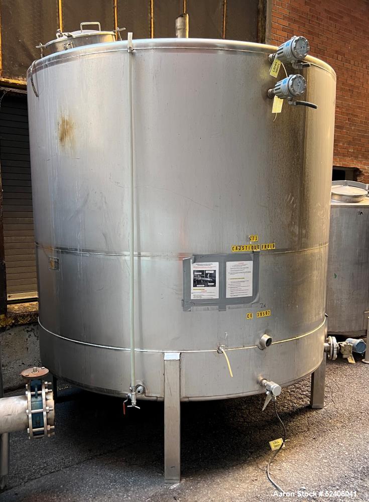 Used Falco Tank, Approximate 2500 Gallon, 304 Stainless Steel, Vertical. Approximate 96" diameter x 84" straight side, coned top & bottom. Mounted on 4 stainless legs. Serial# 2912.