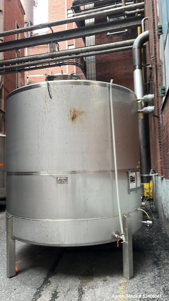 Used Falco Tank, Approximate 2500 Gallon, 304 Stainless Steel, Vertical. Approximate 96" diameter x 84" straight side, coned top & bottom. Mounted on 4 stainless legs. Serial# 2912.
