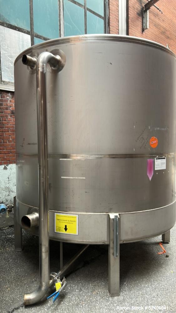 Used Falco Tank, Approximate 2500 Gallon, 304 Stainless Steel, Vertical. Approximate 96" diameter x 84" straight side, coned top & bottom. Mounted on 4 stainless legs. Serial# 2912.