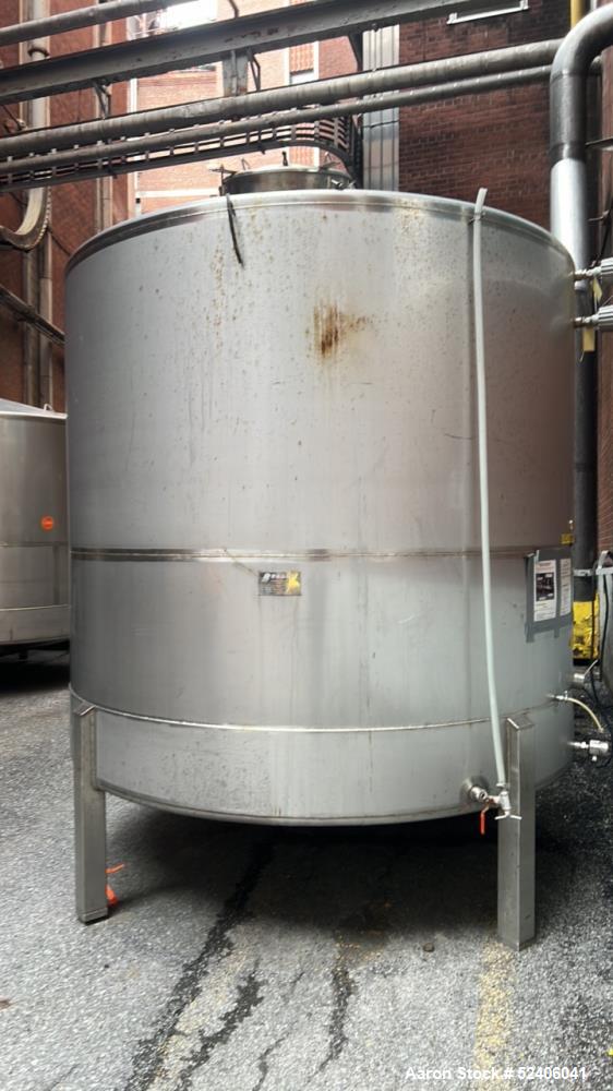 Used Falco Tank, Approximate 2500 Gallon, 304 Stainless Steel, Vertical. Approximate 96" diameter x 84" straight side, coned top & bottom. Mounted on 4 stainless legs. Serial# 2912.