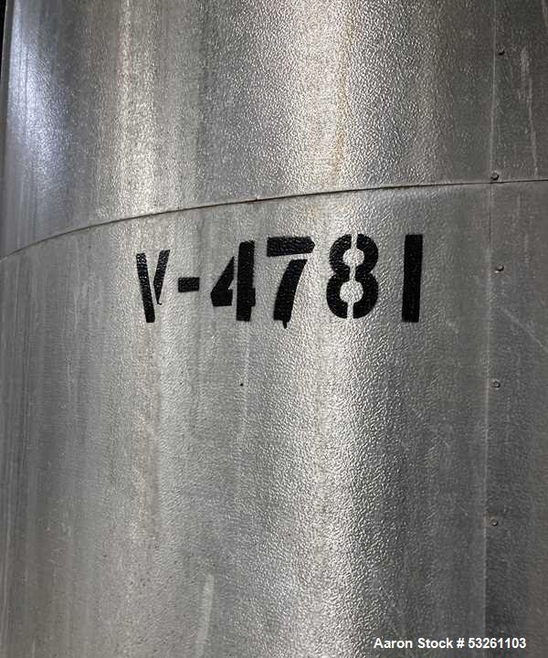 Used Approximate 4750 gallon Stainless Steel Agitated Tank With 5 HP Centrifugal Pump, V-4781. Top entering agitator (HP unknown). Cone bottom with center bottom outlet. Side bottom manway.