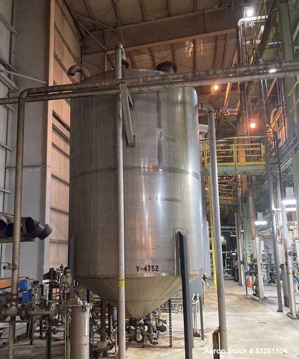 Used Approximate 4000 gallon Stainless Steel Storage Tank With 7.5 HP Centrifugal Pump, V-4782.  Misc. top inlets. Cone bottom with center bottom outlet. Bottom side manway. With 7.5 HP stainless ste...