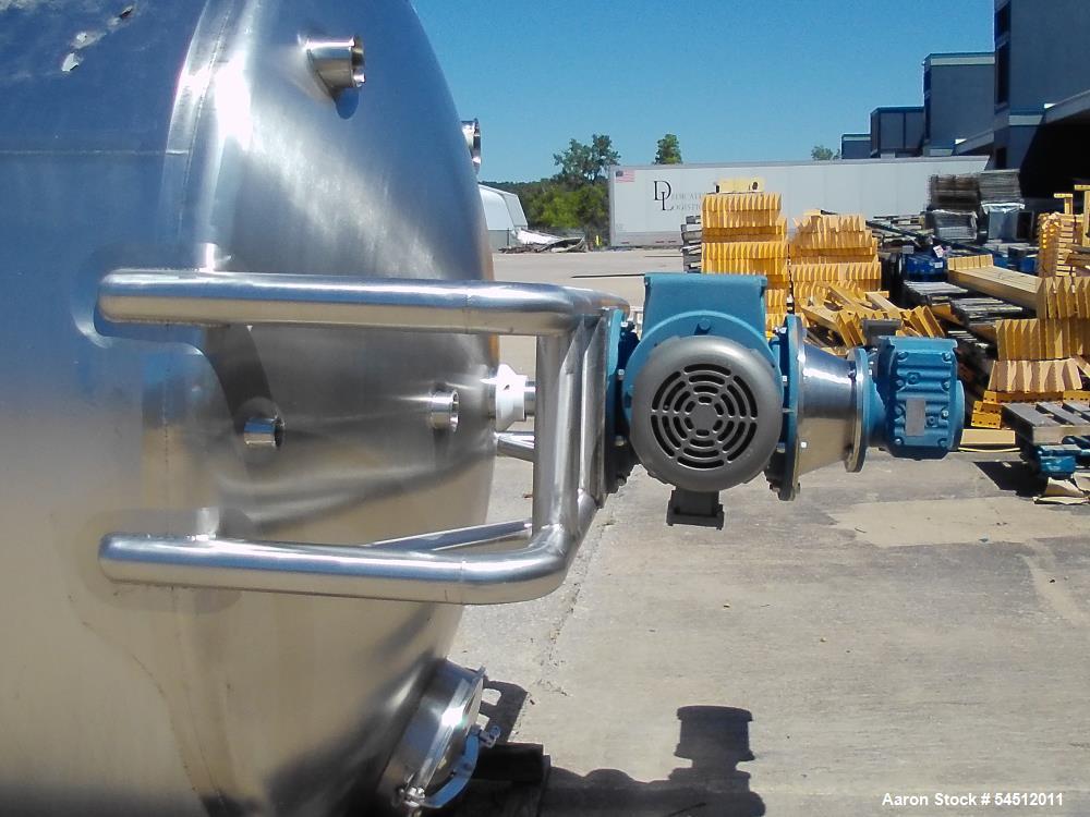 Unused 2,000 Gallon Vertical Stainless Steel Agitated Tank. Dished top and bottom. Stainless steel top agitator bridge with counter rotating side scrape agitation. Top manway. Center bottom outlet. M...