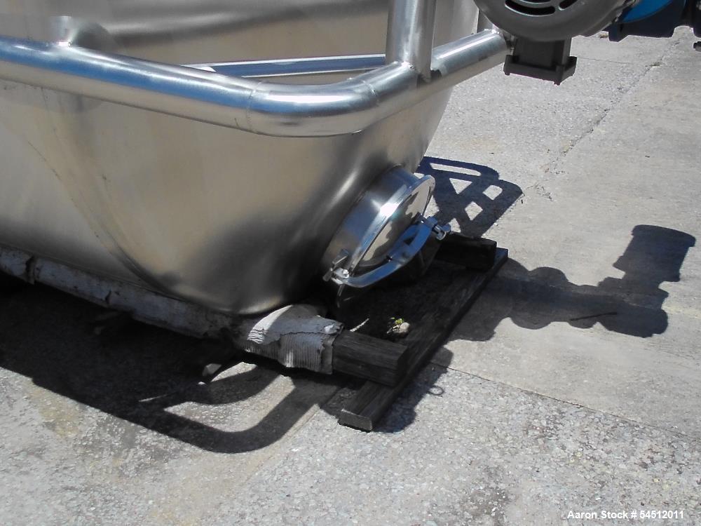Unused 2,000 Gallon Vertical Stainless Steel Agitated Tank. Dished top and bottom. Stainless steel top agitator bridge with counter rotating side scrape agitation. Top manway. Center bottom outlet. M...