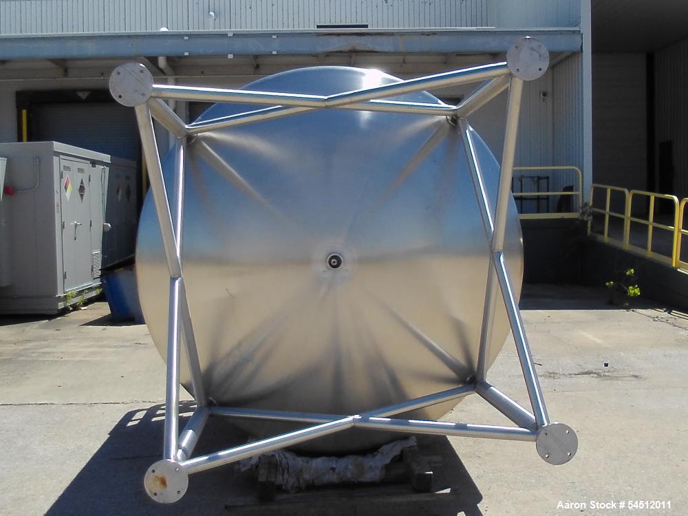 Unused 2,000 Gallon Vertical Stainless Steel Agitated Tank. Dished top and bottom. Stainless steel top agitator bridge with counter rotating side scrape agitation. Top manway. Center bottom outlet. M...