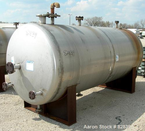 USED: Tank, 1,250 gallon, 304 stainless steel, horizontal. 54" diameter x 120" straight side, dished ends. Openings: top (2) 2", 1", 4"; ends (4) 1-1/2", 2-1/2", 2", 17" manway, no cover; bottom 1-1/...