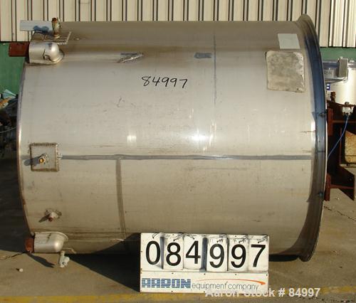 USED: 1000 gallon 304 stainless steel vertical mixing tank. 66" diameter x 72-1/2" straight side. Bridge mounted gearmotor, 7-1/2 hp, 3/60/460 volt, 1755 rpm, with Lightnin agitator, 16.8:1 ratio. Ou...