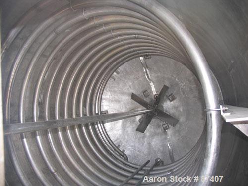 USED: Tank, 2775 gallon, 316 stainless steel. 7'6" diameter x 9'6" straight side, vertical, 4 legs, 2" center bottom outlet. 3 hp Lightnin agitator, 2" shaft with steady bearing, flat top with manway...