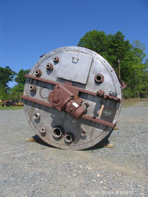 USED: Tank, 2403 gallon, 316 stainless steel. 6'6" diameter x 9'7" straight side, flat top, dish bottom, internal atmospheric, internal coils, vertical, with 3 hp Philadelphia top mount agitator, 2" ...