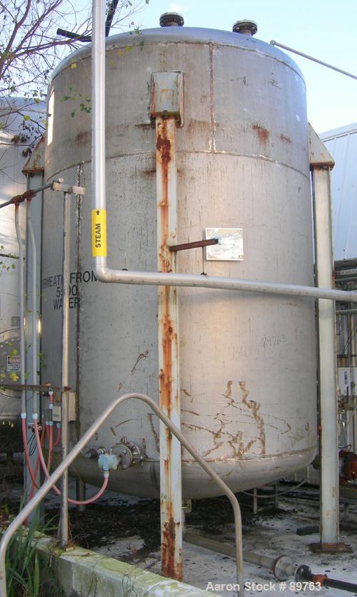 USED: Approximate 5000 gallon stainless steel storage tank. Approximate 8'-6" diameter x 11' straight side. Dished heads. Miscellaneous top openings including manway with bolt-on cover. 3" center bot...