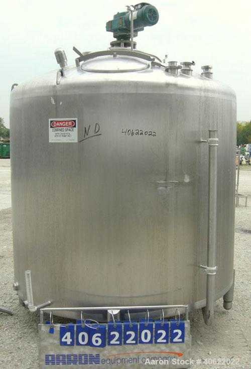 Used APV Crepaco Tank, 1500 Gallon, 304 Stainless Steel, Vertical. 84" diameter x 66" straight side. Dish top, sloped bottom. Fixed stainless steel agitator bridge with a 2" diameter bottom supported...