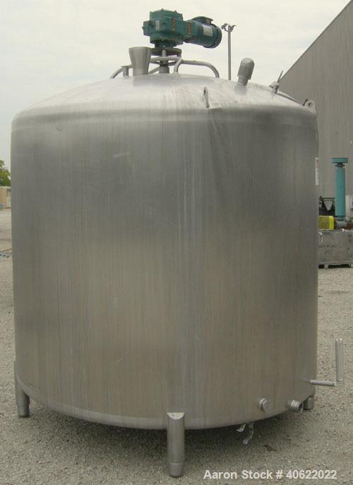 Used APV Crepaco Tank, 1500 Gallon, 304 Stainless Steel, Vertical. 84" diameter x 66" straight side. Dish top, sloped bottom. Fixed stainless steel agitator bridge with a 2" diameter bottom supported...