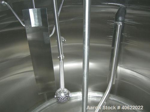 Used APV Crepaco Tank, 1500 Gallon, 304 Stainless Steel, Vertical. 84" diameter x 66" straight side. Dish top, sloped bottom. Fixed stainless steel agitator bridge with a 2" diameter bottom supported...