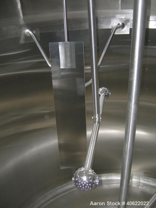 Used APV Crepaco Tank, 1500 Gallon, 304 Stainless Steel, Vertical. 84" diameter x 66" straight side. Dish top, sloped bottom. Fixed stainless steel agitator bridge with a 2" diameter bottom supported...