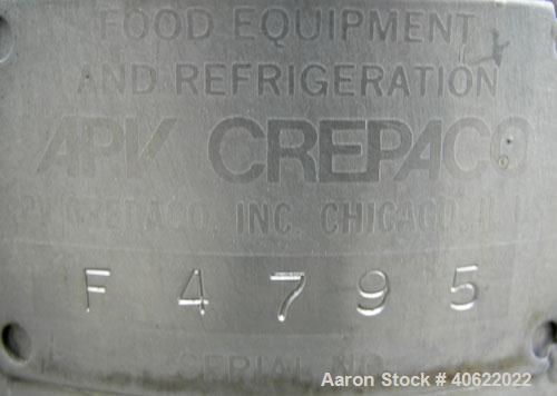 Used APV Crepaco Tank, 1500 Gallon, 304 Stainless Steel, Vertical. 84" diameter x 66" straight side. Dish top, sloped bottom. Fixed stainless steel agitator bridge with a 2" diameter bottom supported...