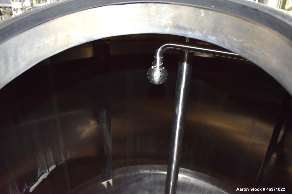 Used APV Crepaco Tank, 1500 Gallon, 304 Stainless Steel, Vertical. Approximate 84" Diameter x 56" straight side, dished top, 35 degree coned bottom. Internal rated 15 psi at 200 degrees F. Top enteri...
