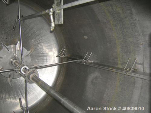 Used Acme Tank, 1500 Gallon, 304 Stainless Steel, Vertical. 72" Diameter x 84" straight side, dished top and bottom. Carbon steel jacket on partial sidewall and bottom head, no rating. Top entering L...
