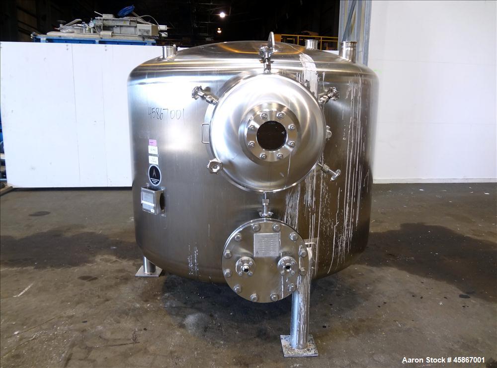 Used Apache Stainless Equipment Tank, 1,010 Gallon, 316L Stainless Steel, Vertical. 76" Diameter x 44" straight side. Dish top and bottom. Internal rated atmospheric to 200 degrees F. 2" Diameter rem...