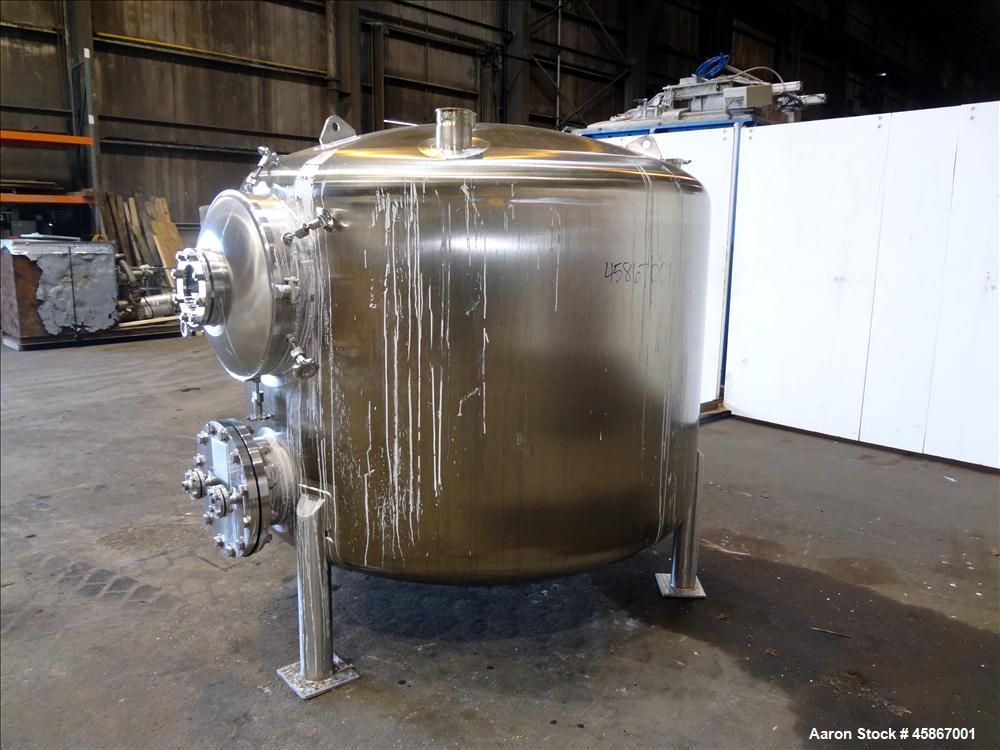 Used Apache Stainless Equipment Tank, 1,010 Gallon, 316L Stainless Steel, Vertical. 76" Diameter x 44" straight side. Dish top and bottom. Internal rated atmospheric to 200 degrees F. 2" Diameter rem...