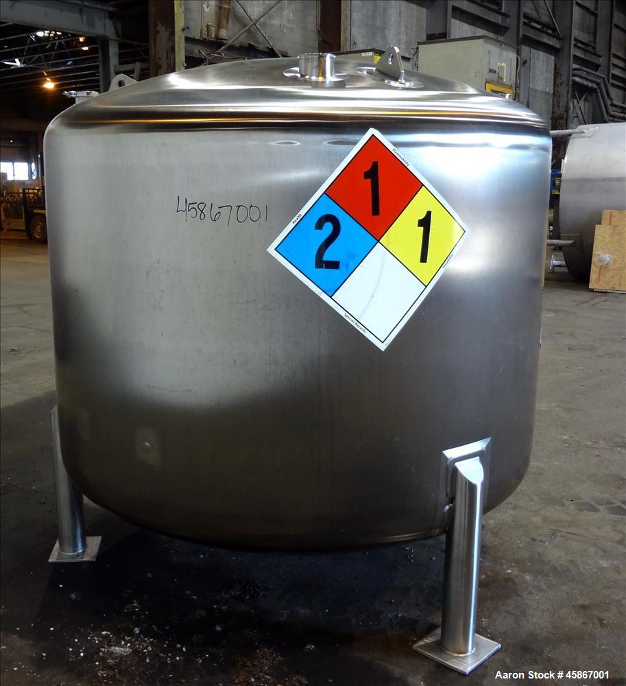 Used Apache Stainless Equipment Tank, 1,010 Gallon, 316L Stainless Steel, Vertical. 76" Diameter x 44" straight side. Dish top and bottom. Internal rated atmospheric to 200 degrees F. 2" Diameter rem...