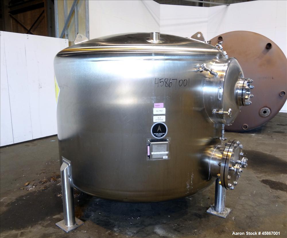 Used Apache Stainless Equipment Tank, 1,010 Gallon, 316L Stainless Steel, Vertical. 76" Diameter x 44" straight side. Dish top and bottom. Internal rated atmospheric to 200 degrees F. 2" Diameter rem...