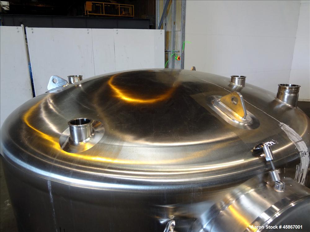 Used Apache Stainless Equipment Tank, 1,010 Gallon, 316L Stainless Steel, Vertical. 76" Diameter x 44" straight side. Dish top and bottom. Internal rated atmospheric to 200 degrees F. 2" Diameter rem...