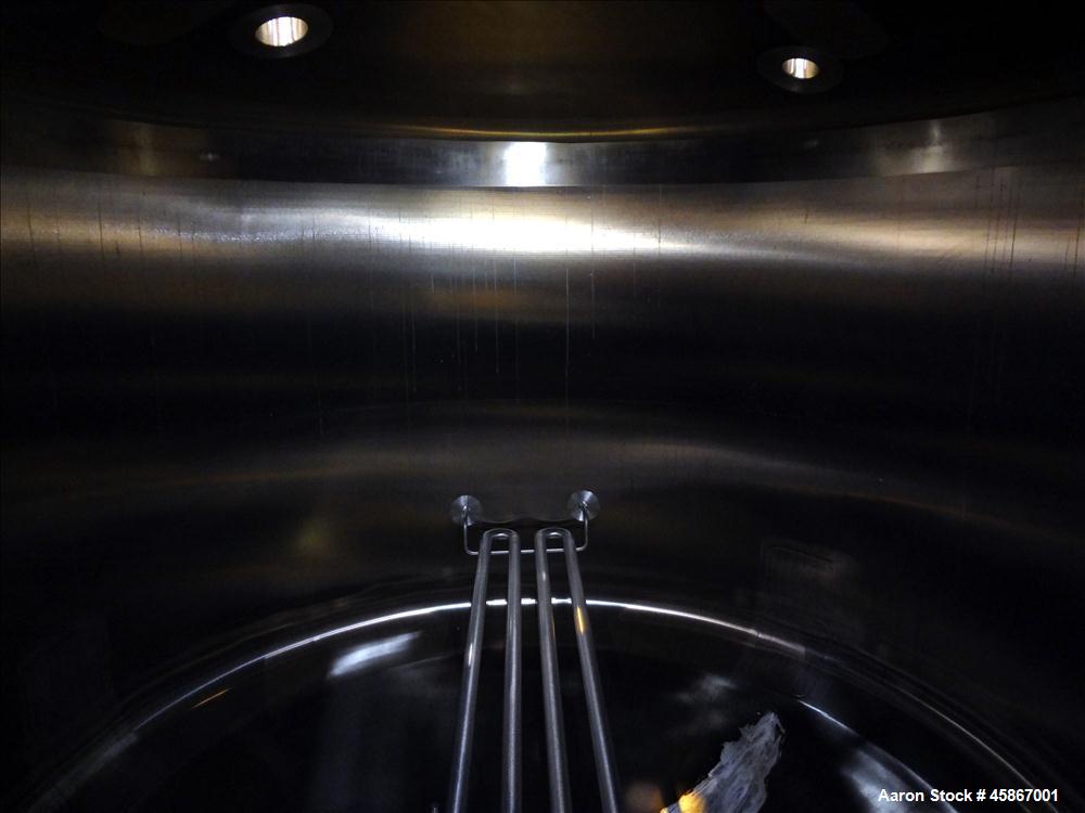 Used Apache Stainless Equipment Tank, 1,010 Gallon, 316L Stainless Steel, Vertical. 76" Diameter x 44" straight side. Dish top and bottom. Internal rated atmospheric to 200 degrees F. 2" Diameter rem...