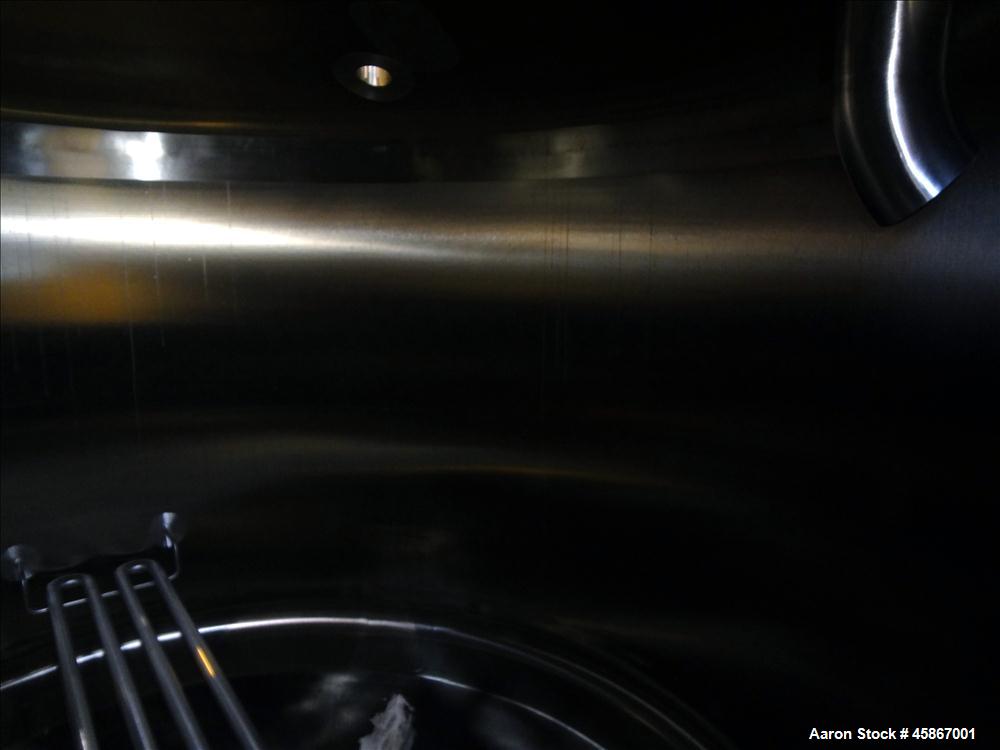 Used Apache Stainless Equipment Tank, 1,010 Gallon, 316L Stainless Steel, Vertical. 76" Diameter x 44" straight side. Dish top and bottom. Internal rated atmospheric to 200 degrees F. 2" Diameter rem...