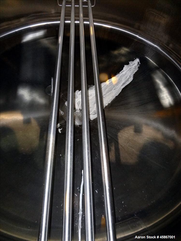 Used Apache Stainless Equipment Tank, 1,010 Gallon, 316L Stainless Steel, Vertical. 76" Diameter x 44" straight side. Dish top and bottom. Internal rated atmospheric to 200 degrees F. 2" Diameter rem...