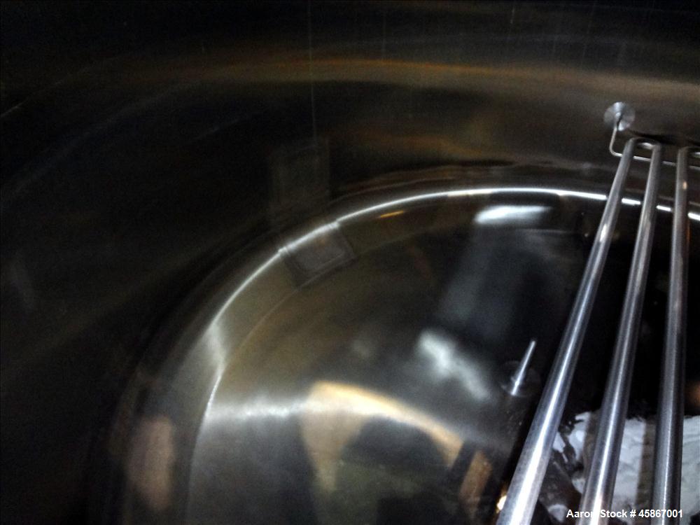 Used Apache Stainless Equipment Tank, 1,010 Gallon, 316L Stainless Steel, Vertical. 76" Diameter x 44" straight side. Dish top and bottom. Internal rated atmospheric to 200 degrees F. 2" Diameter rem...