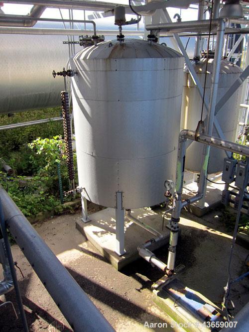 Used Arrow Tank & Engineering Pressure Tank, 1200 Gallons, 304L Stainless Steel, Vertical. Approximate 66” diameter x 75” straight side, dished top and bottom. Internal rated Full Vacuum & 50psi at -...