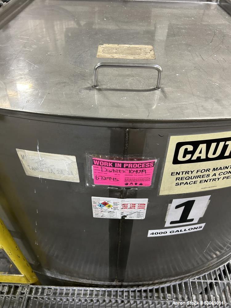 Used Bright Sheet Metal Tank, Approximately 4,000 Gallon, 304 Stainless Steel, Vertical. 100" diameter x 120" straight side. Flat top, coned bottom. 34" x 32" top hinged manway cover, 2" center botto...