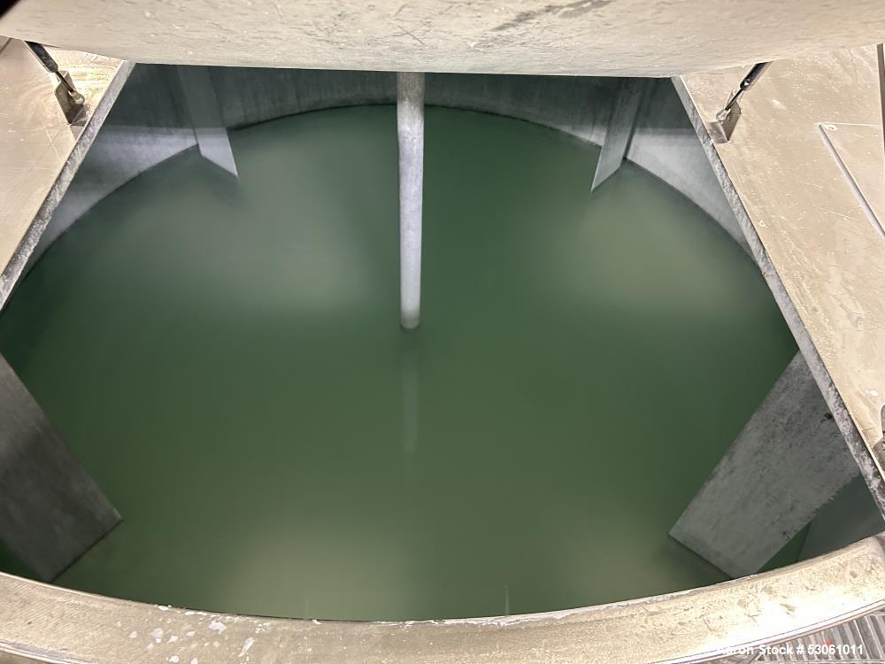 Used Bright Sheet Metal Tank, Approximately 4,000 Gallon, 304 Stainless Steel, Vertical. 100" diameter x 120" straight side. Flat top, coned bottom. 34" x 32" top hinged manway cover, 2" center botto...