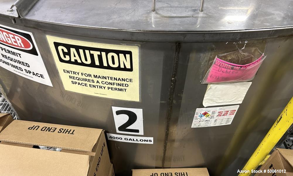 Used Bright Sheet Metal Tank, Approximately 4,000 Gallon, 304 Stainless Steel, Vertical. 100" diameter x 120" straight side. Flat top, coned bottom. 34" x 32" top hinged manway cover, 2" center botto...