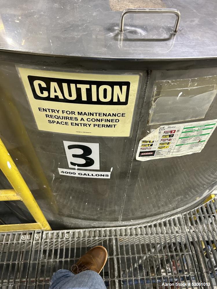 Used Bright Sheet Metal Tank, Approximately 4,000 Gallon, 304 Stainless Steel, Vertical. 100" diameter x 120" straight side. Flat top, coned bottom. 34" x 32" top hinged manway cover, 2" center botto...